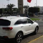 Véhicule TaxiVert stationné près de la place Jemaa el-Fna à Marrakech